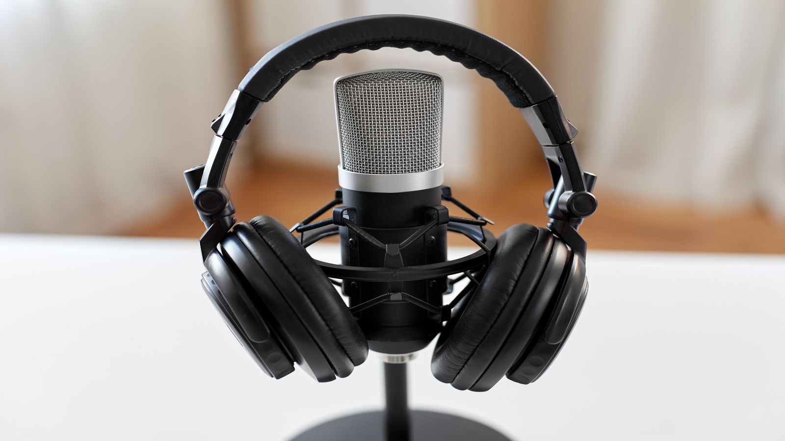 Crypto Token Talk podcast studio with broadcast equipment and waveform displays